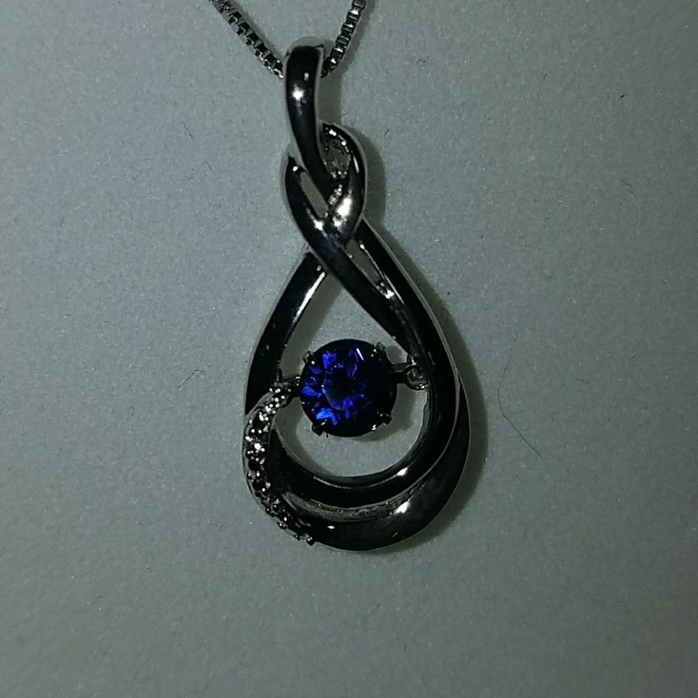 Sterling silver with sapphire in motion