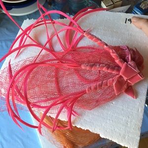 Vintage 1950's hats pink with pink feathers.