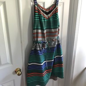 Stripped dress when string pulled waist.