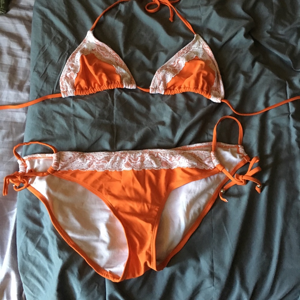 Orange and white bathing suit with lace detail