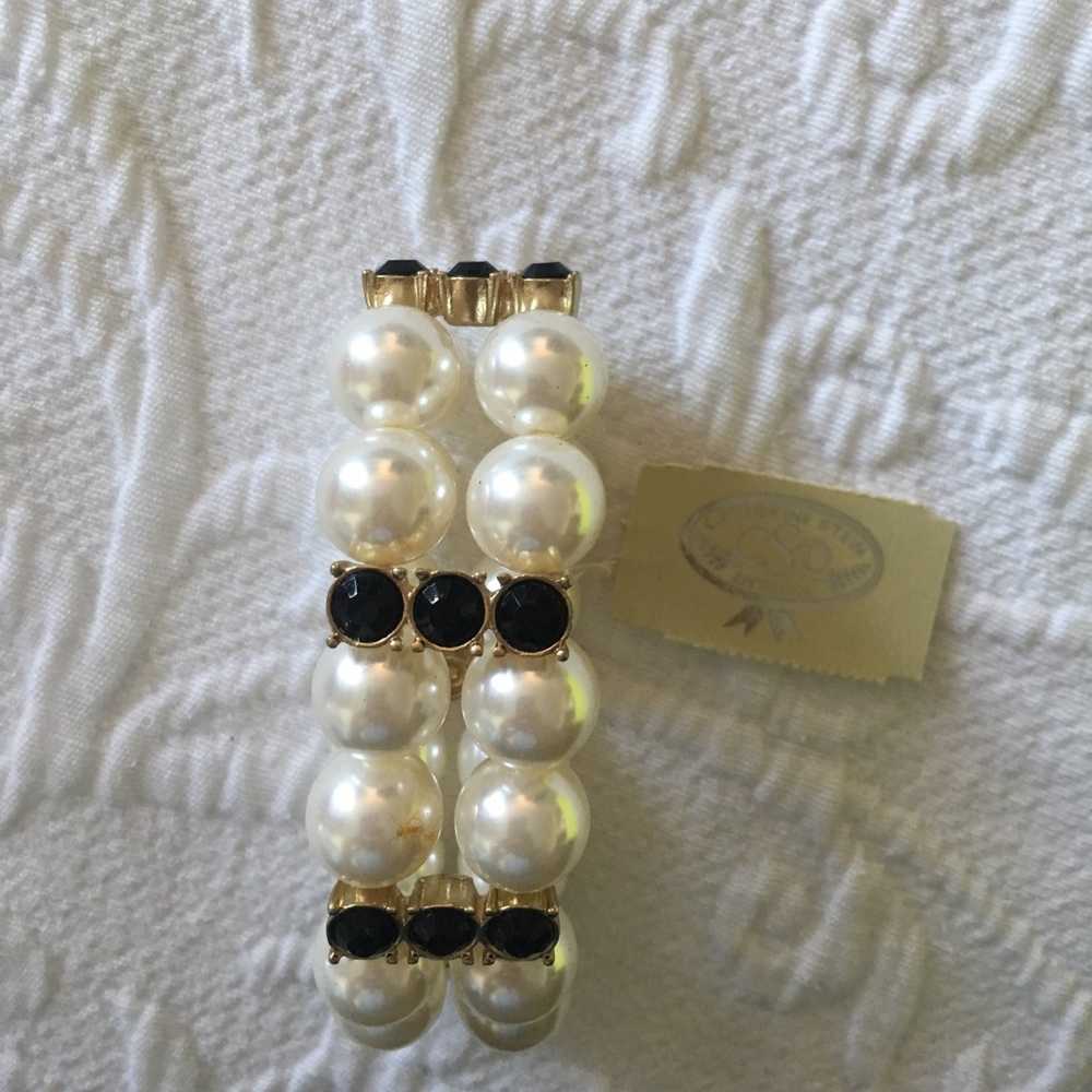 Faux pearl bracelet with black and gold accents
