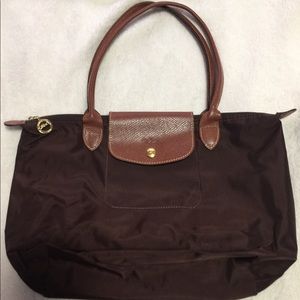 Dark brown le pilage Longchamp shoulder bag.