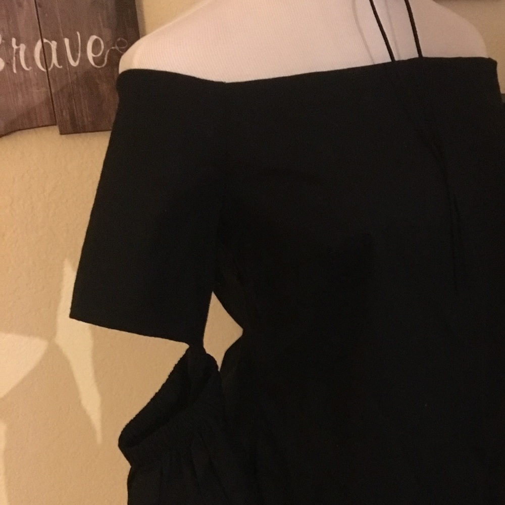 Bebe- Black off shoulder, elbow cut out shirt