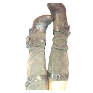 Tan heeled boots with buckles.