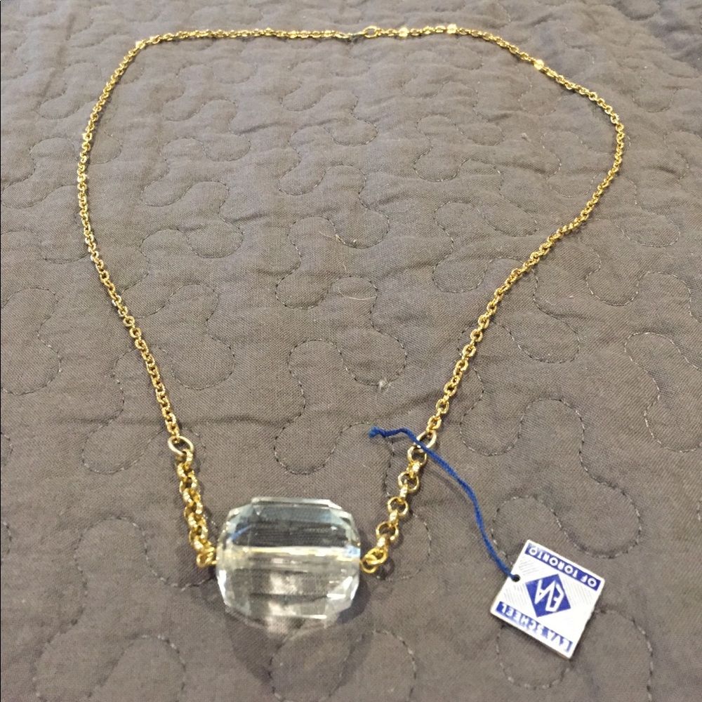 Very cute gold necklace with glass pendant!