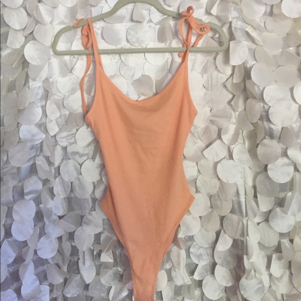 Peach colored bodysuit