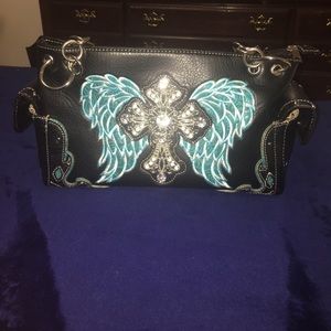 NWOT turquoise cross concealed carry purse