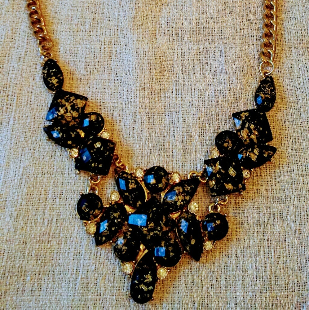 Black stone with gold specks and cubic zirconium s