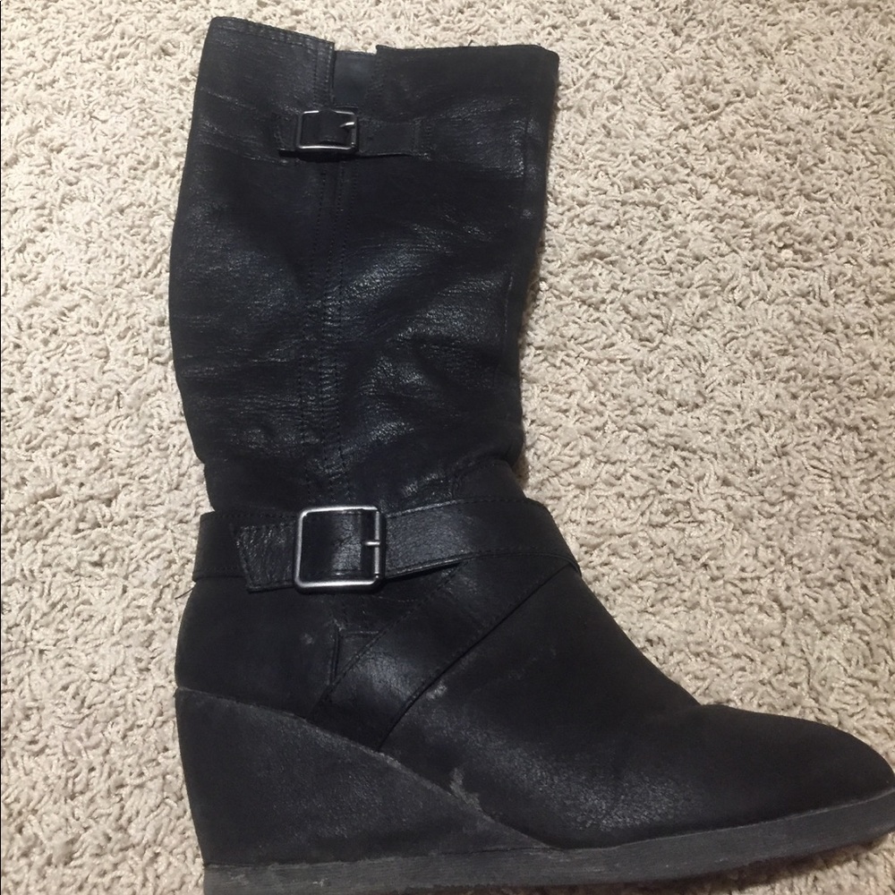 Black boots comfortable. Buckle embellishments.