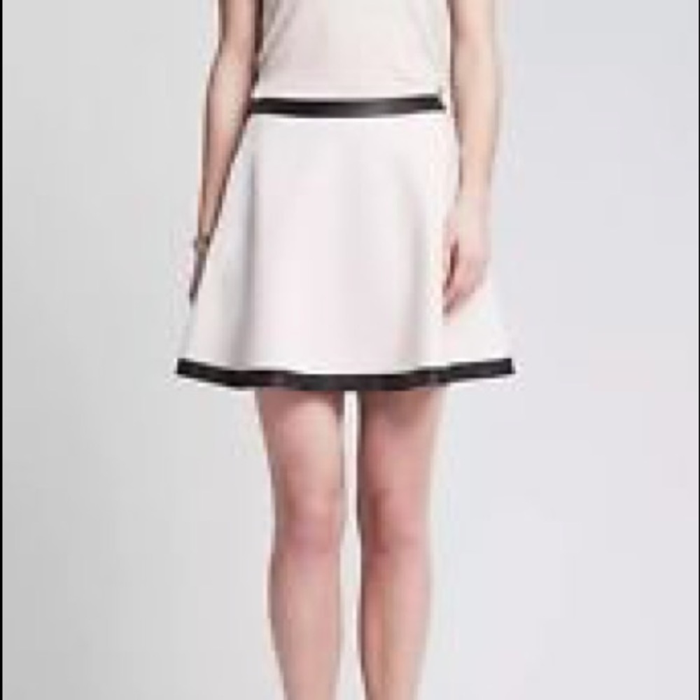 White skirt with black leather trim