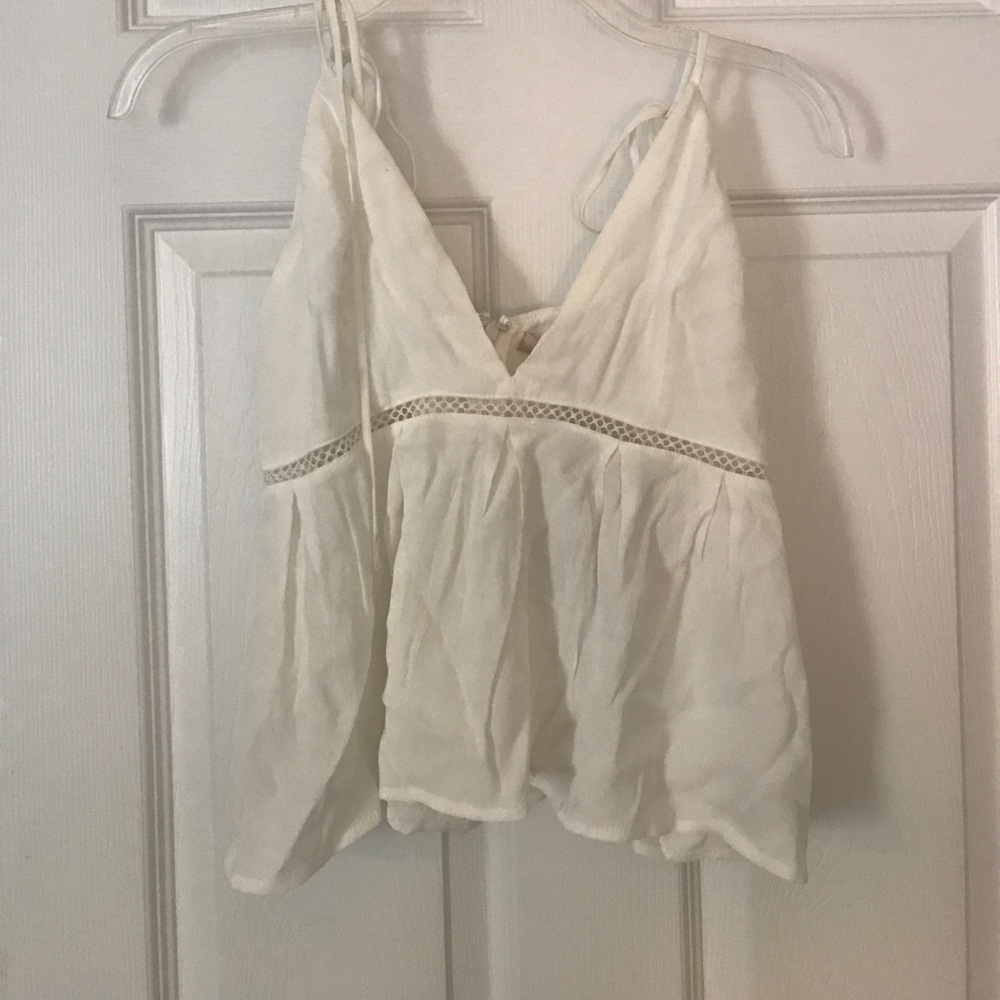 White tank top, ties above the shoulder