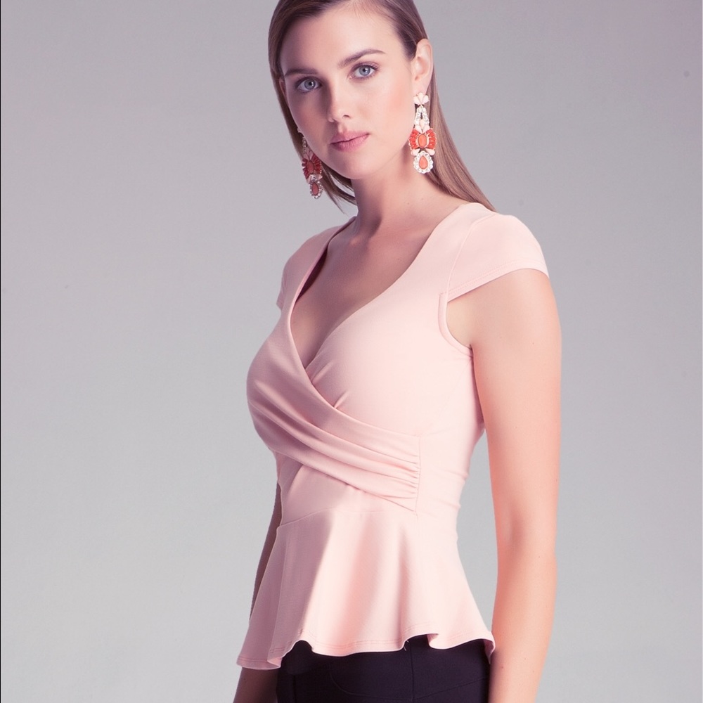 BEBE peach peplum top