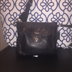 Black genuine leather COACH crossbody.