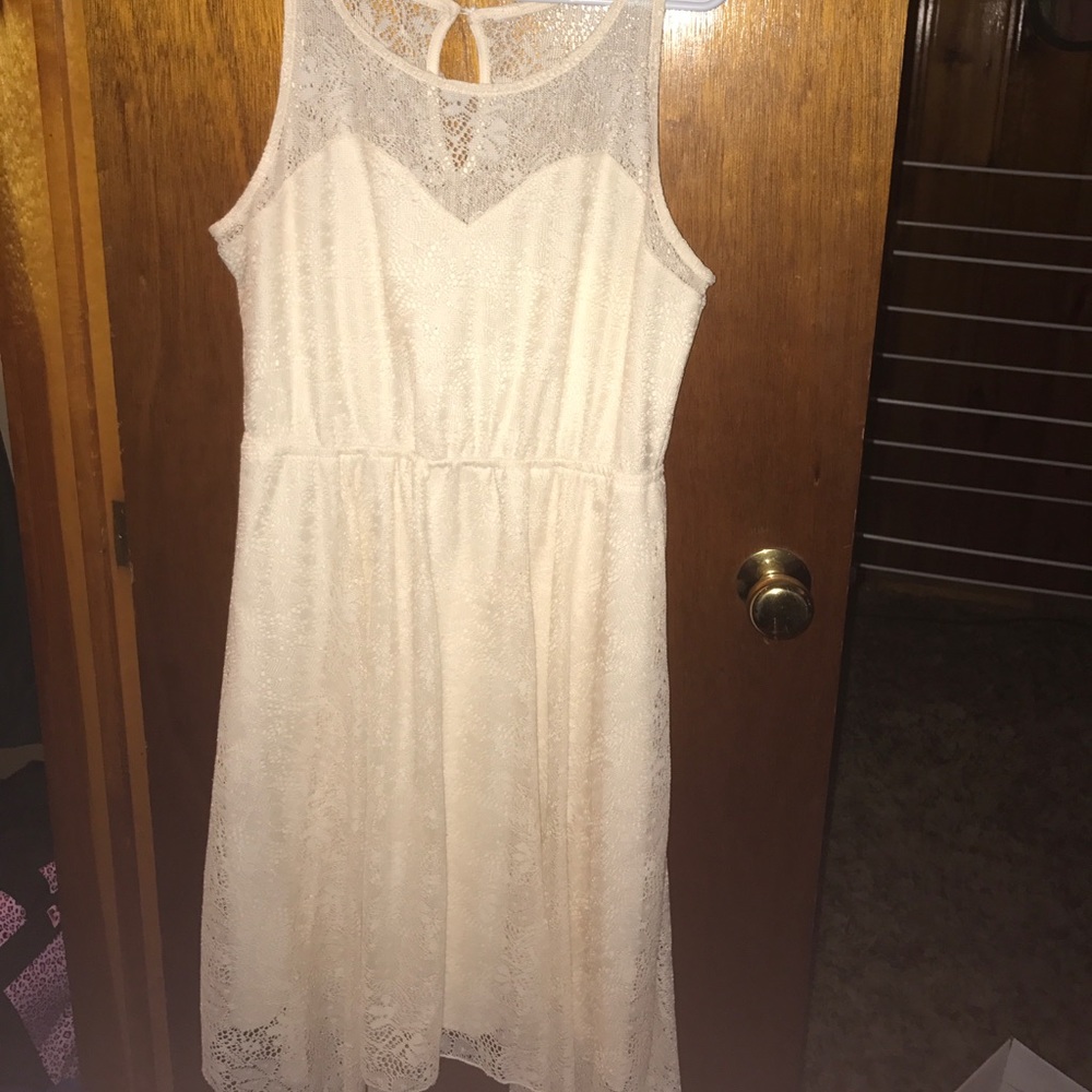 Cream colored summer dress.