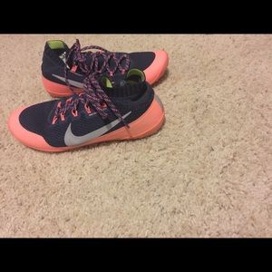 Navy blue and pink Nike running shoes