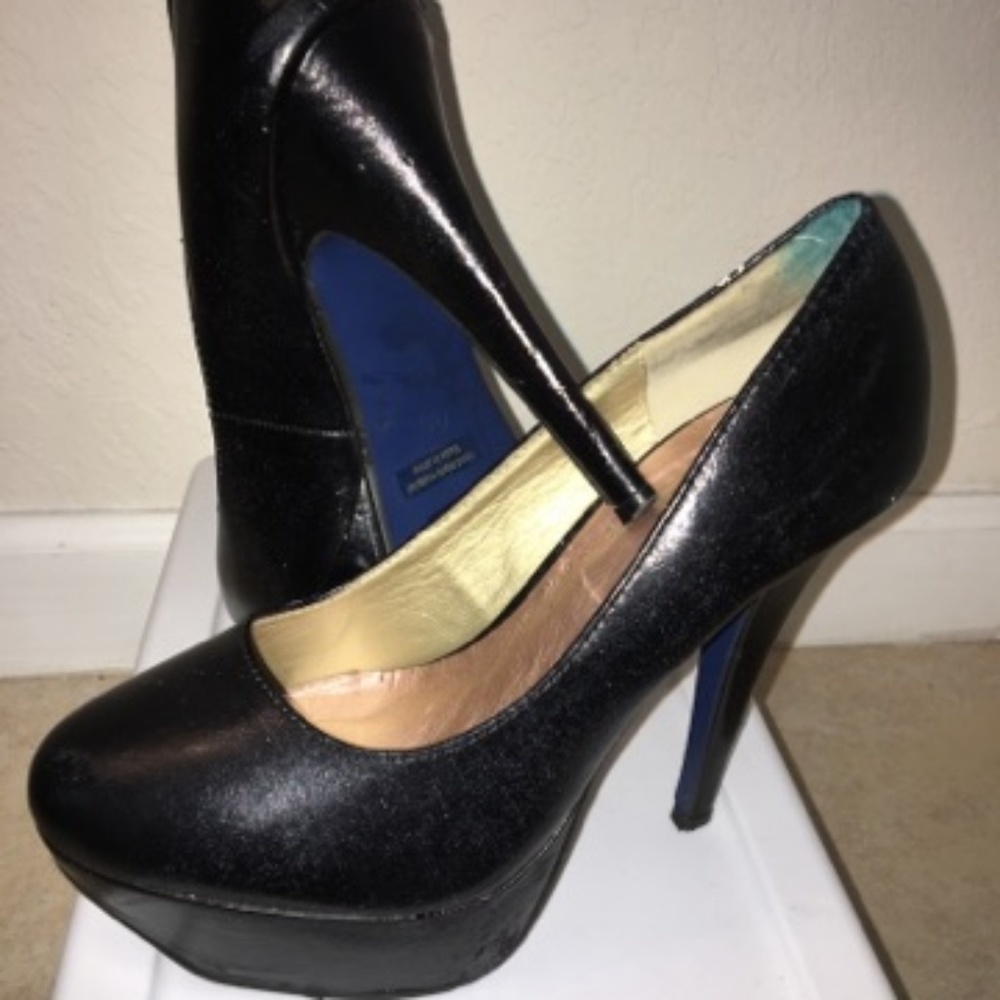All black heels with blue bottoms