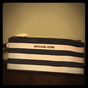 Blue and white striped Michael Kors wristlet