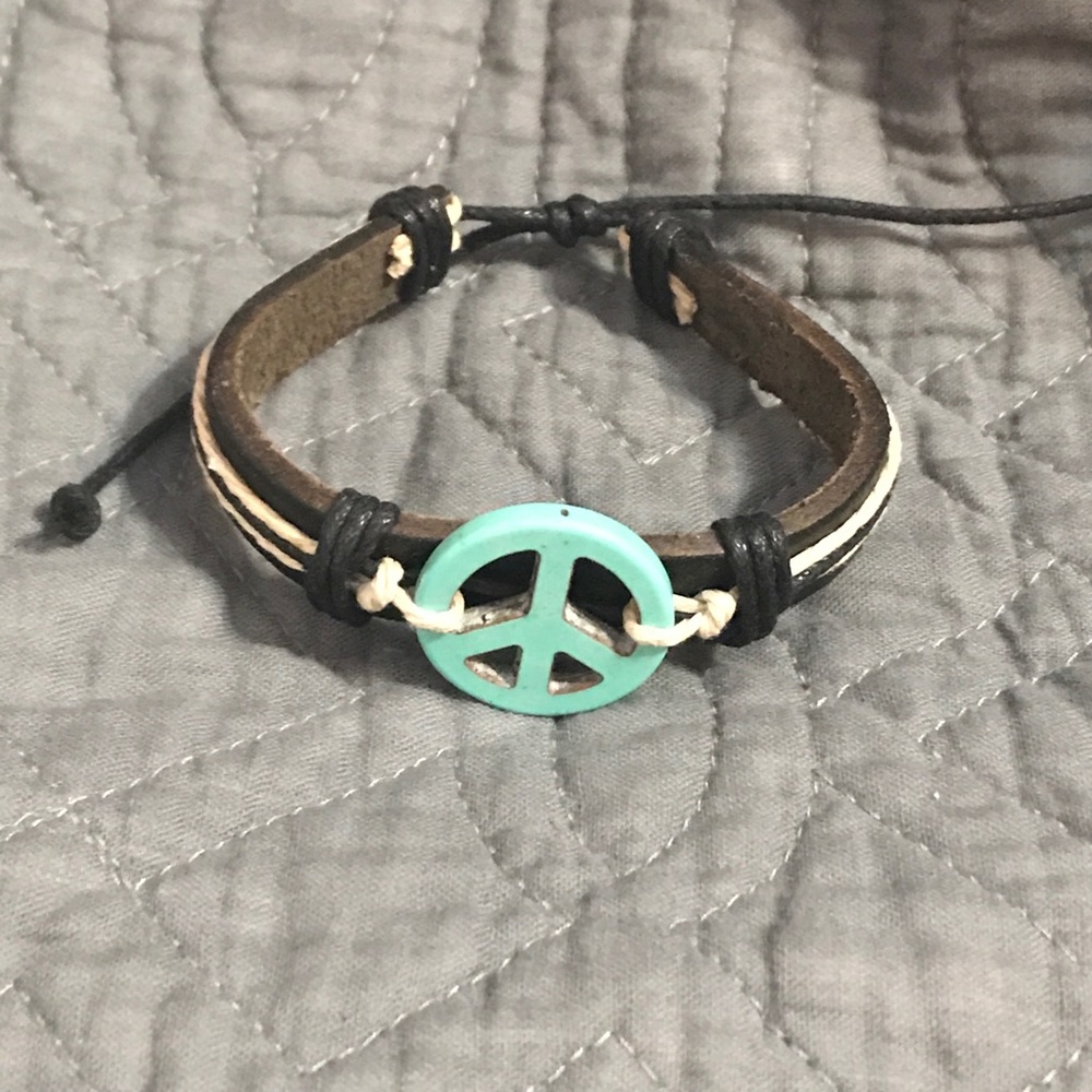Leather peace sign bracelet.