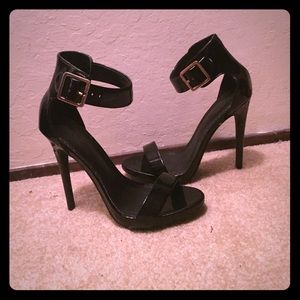 Black heels with gold buckle