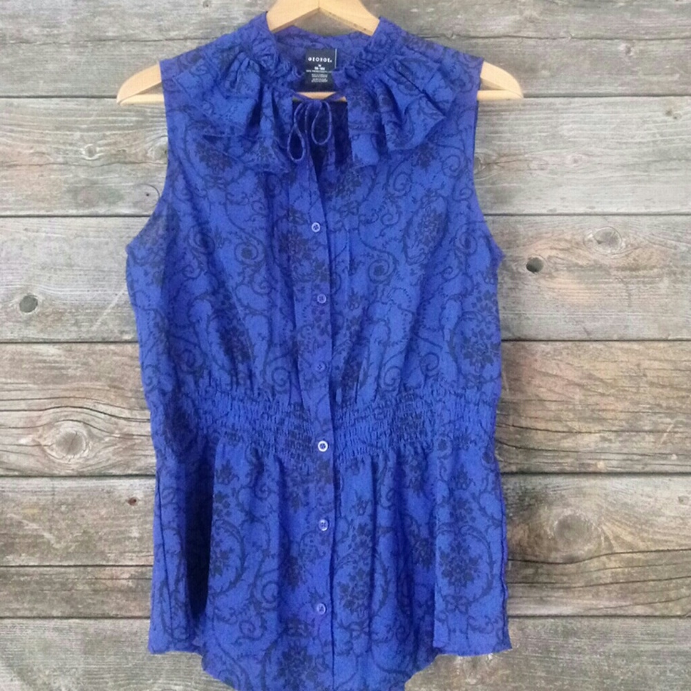 Sheer 8/10 sleeveless ruffle top.