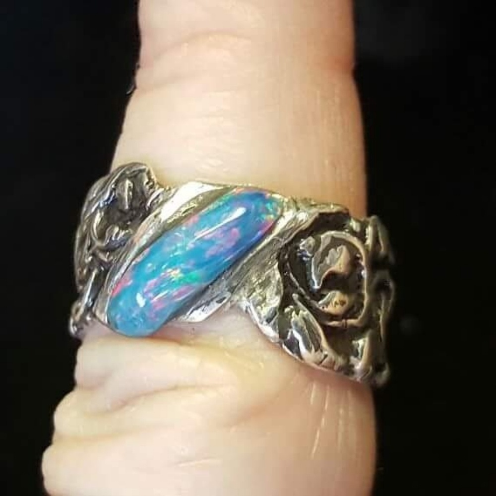 Nice heavy Sterling silver flowered opal ring.