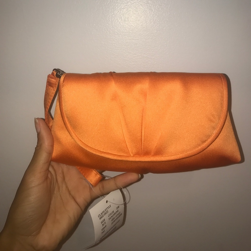 Matching clutch with orange dress!