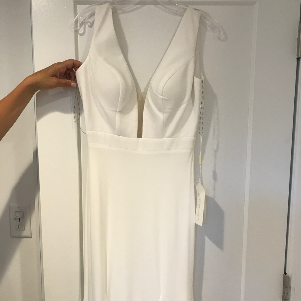 White evening gown with sheer mesh at v.