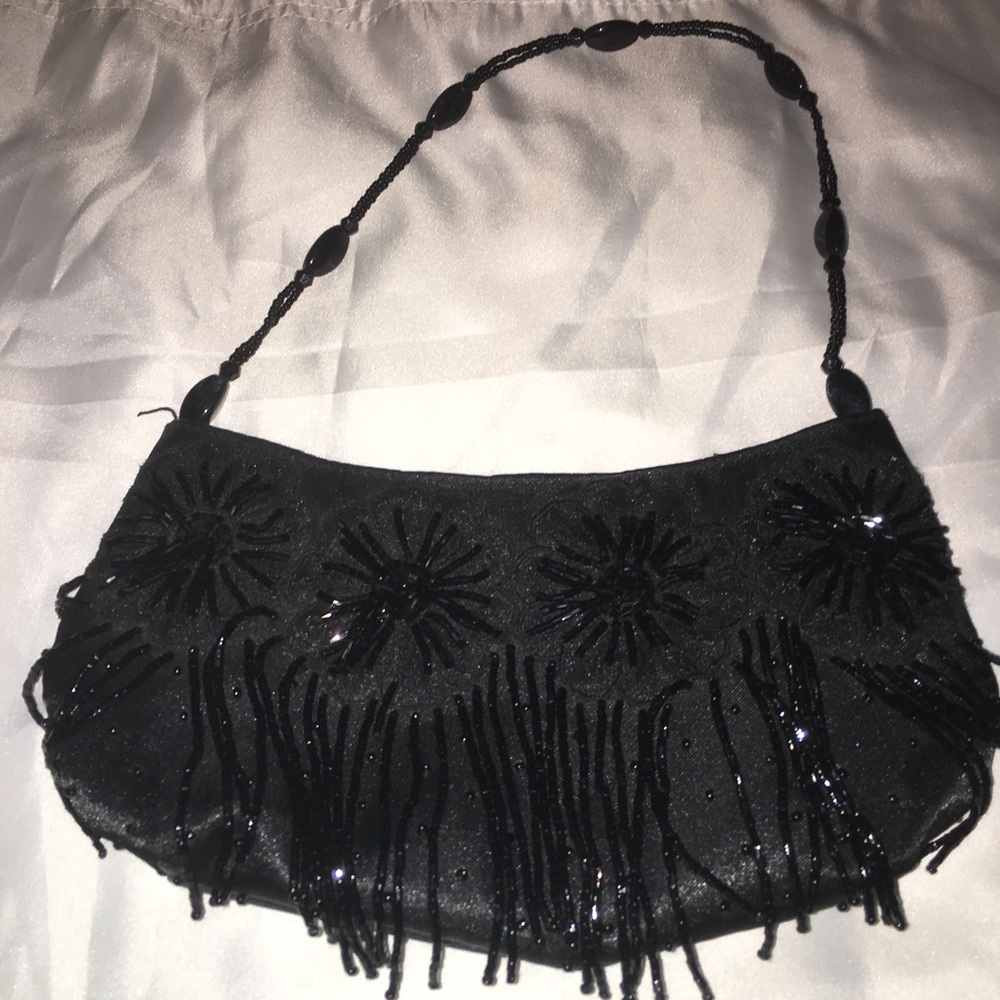 Black clutch by Jessica McClintock