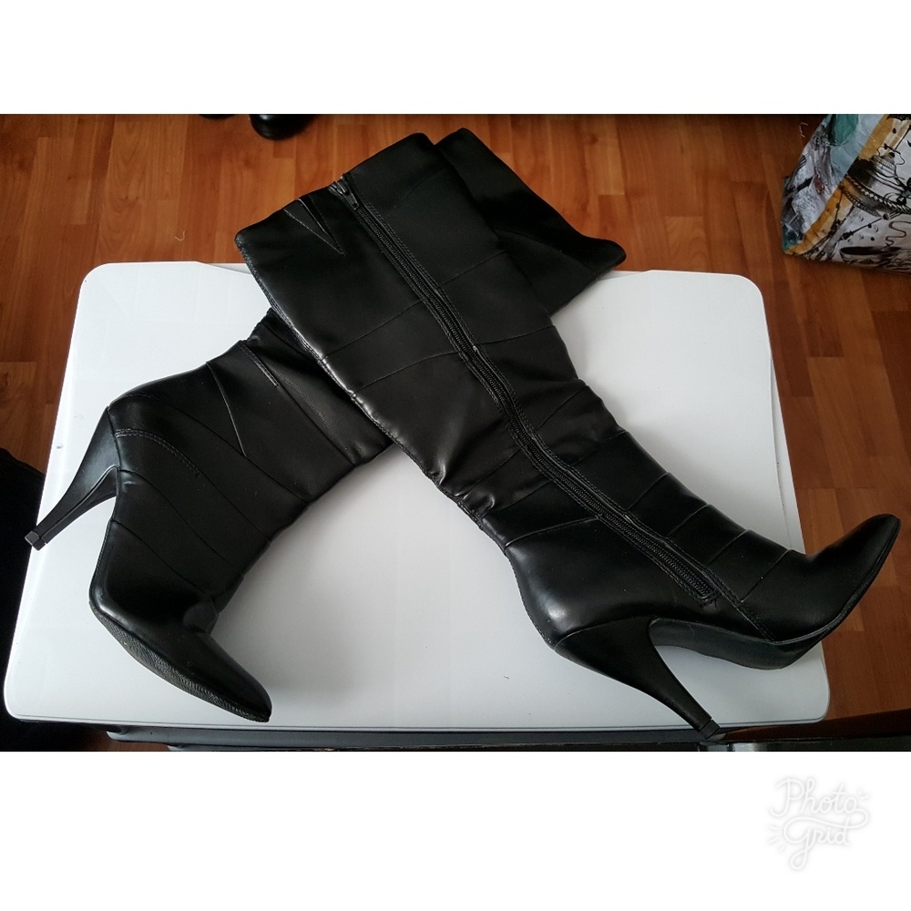 Black knee high heeled boots