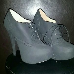 Black lace up high heeled booties