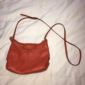 Bright orange Coach cross body purse