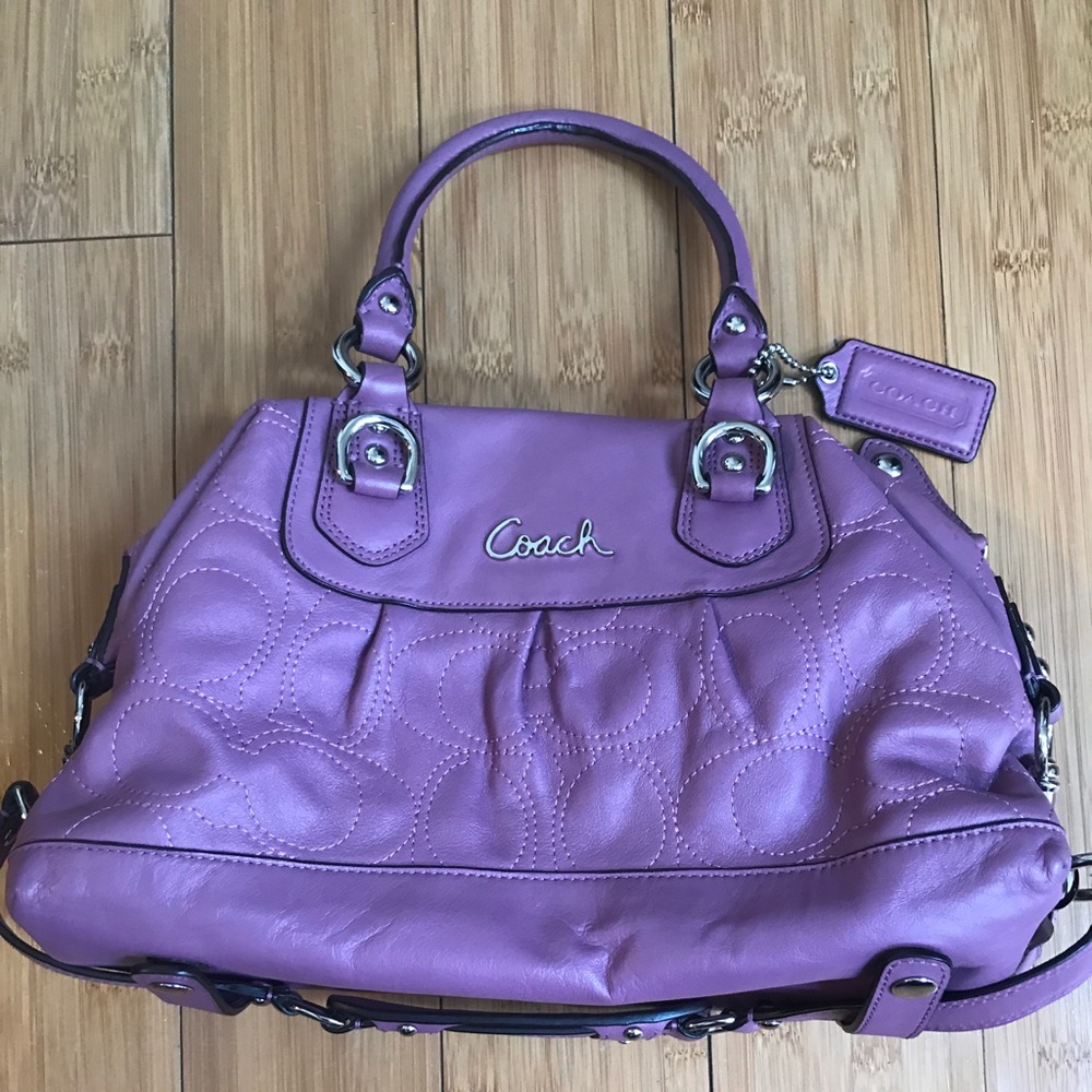 Light purple Coach hand bag.