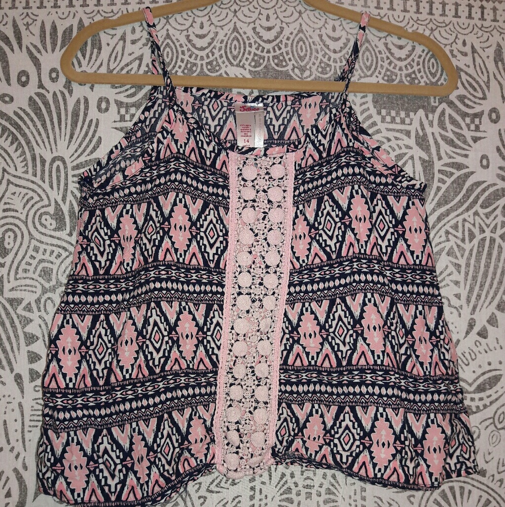 An pink , white and dark blue top