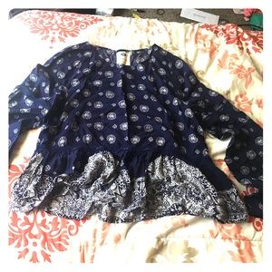 It is a crop flared out top.