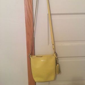 Yellow Coach purse corssbody bag for sale.