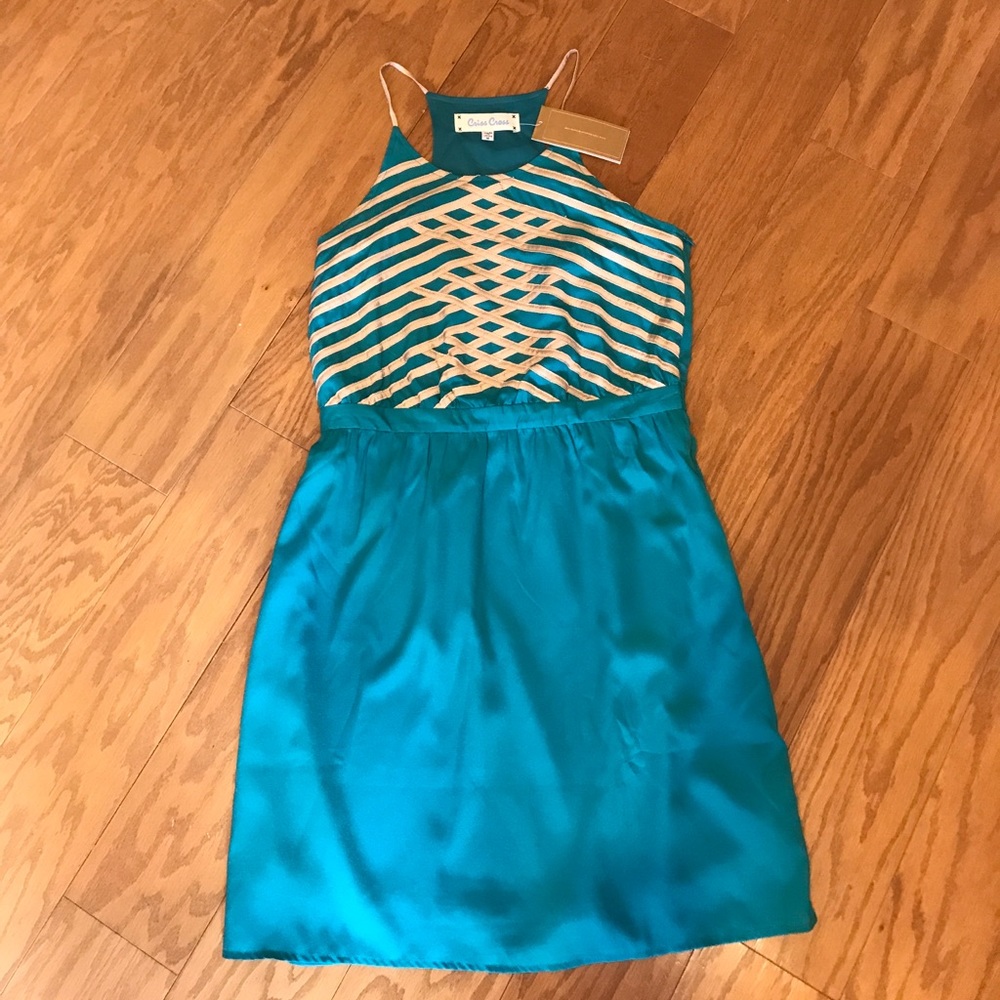 Criss cross teal dress with gold detail