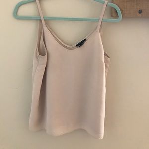 A cream colored tank top