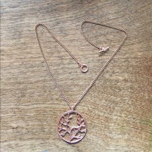 Bright copper plated tree of life necklace.