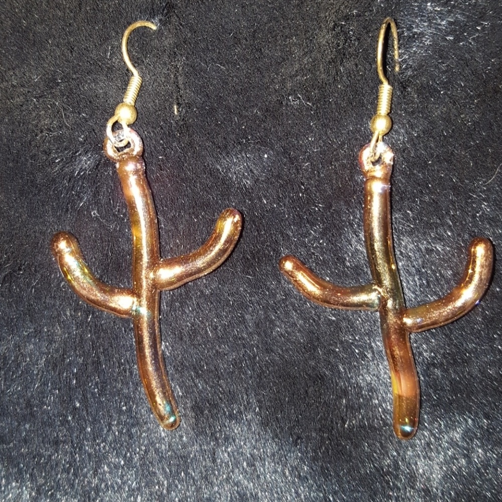 Copper tone hand blown glass saguaro earrings.