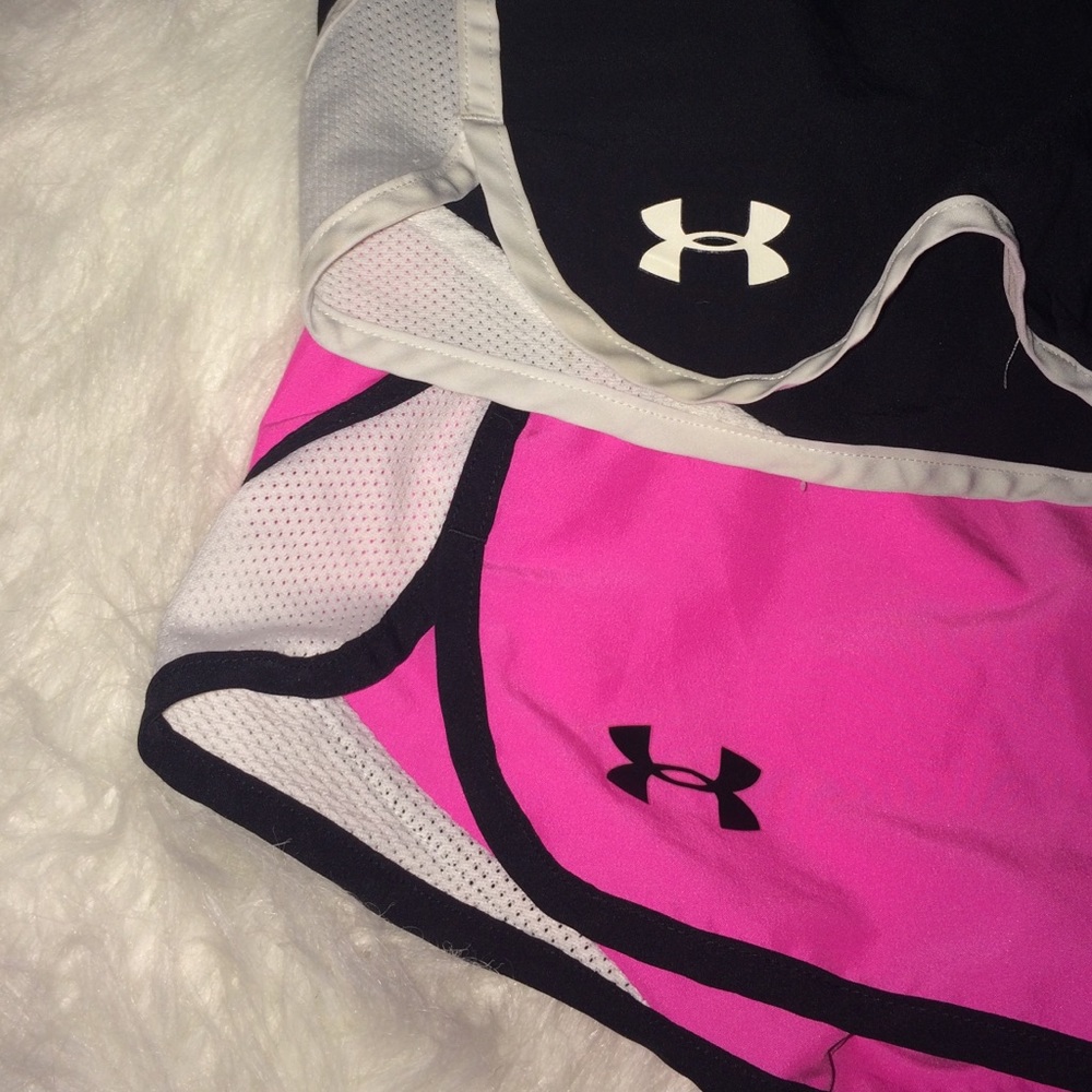 two pairs of ua shorts