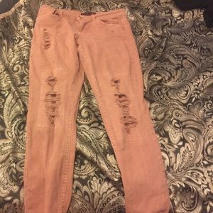 Pink ripped skinny jeans