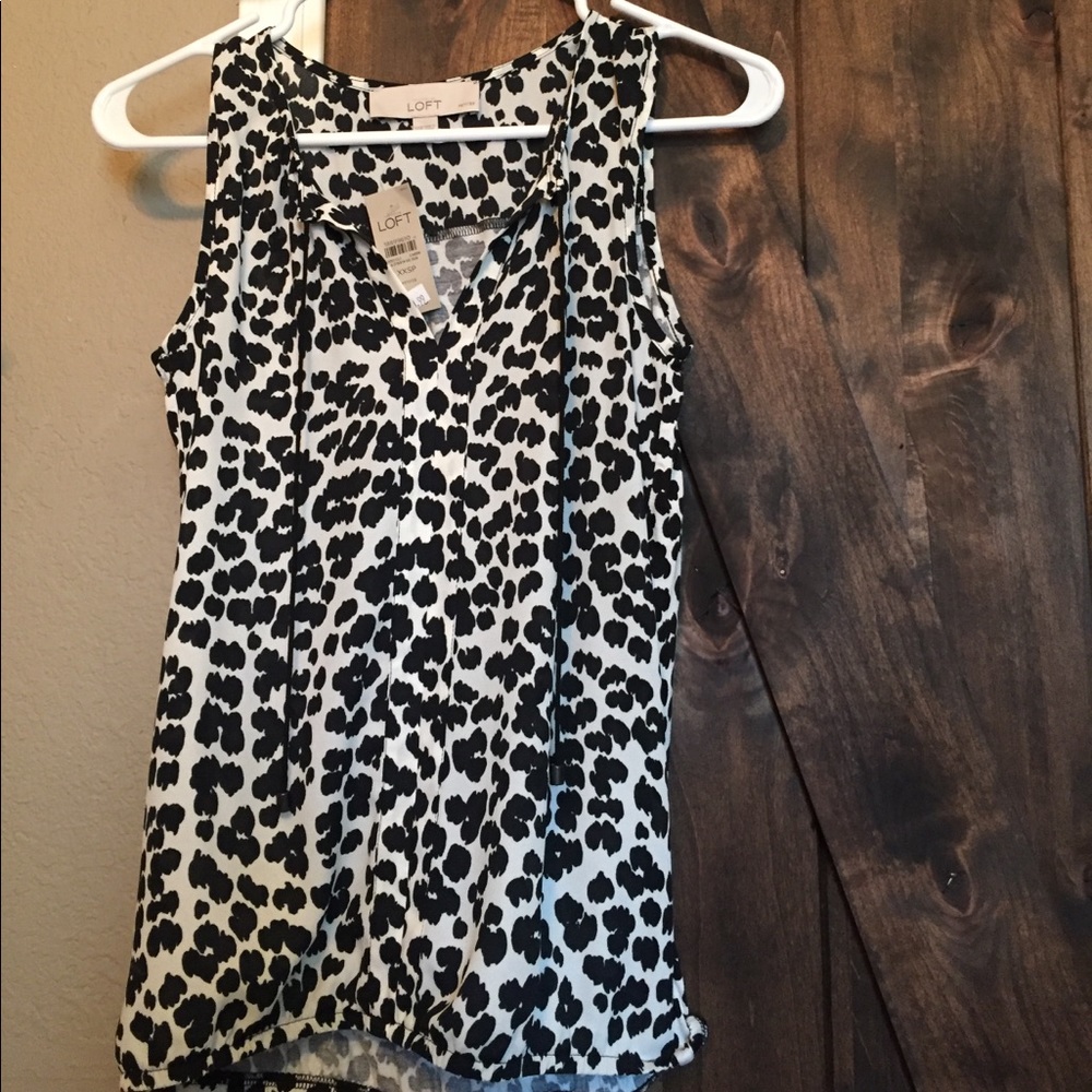 NWT: Black and white sleeveless shirt