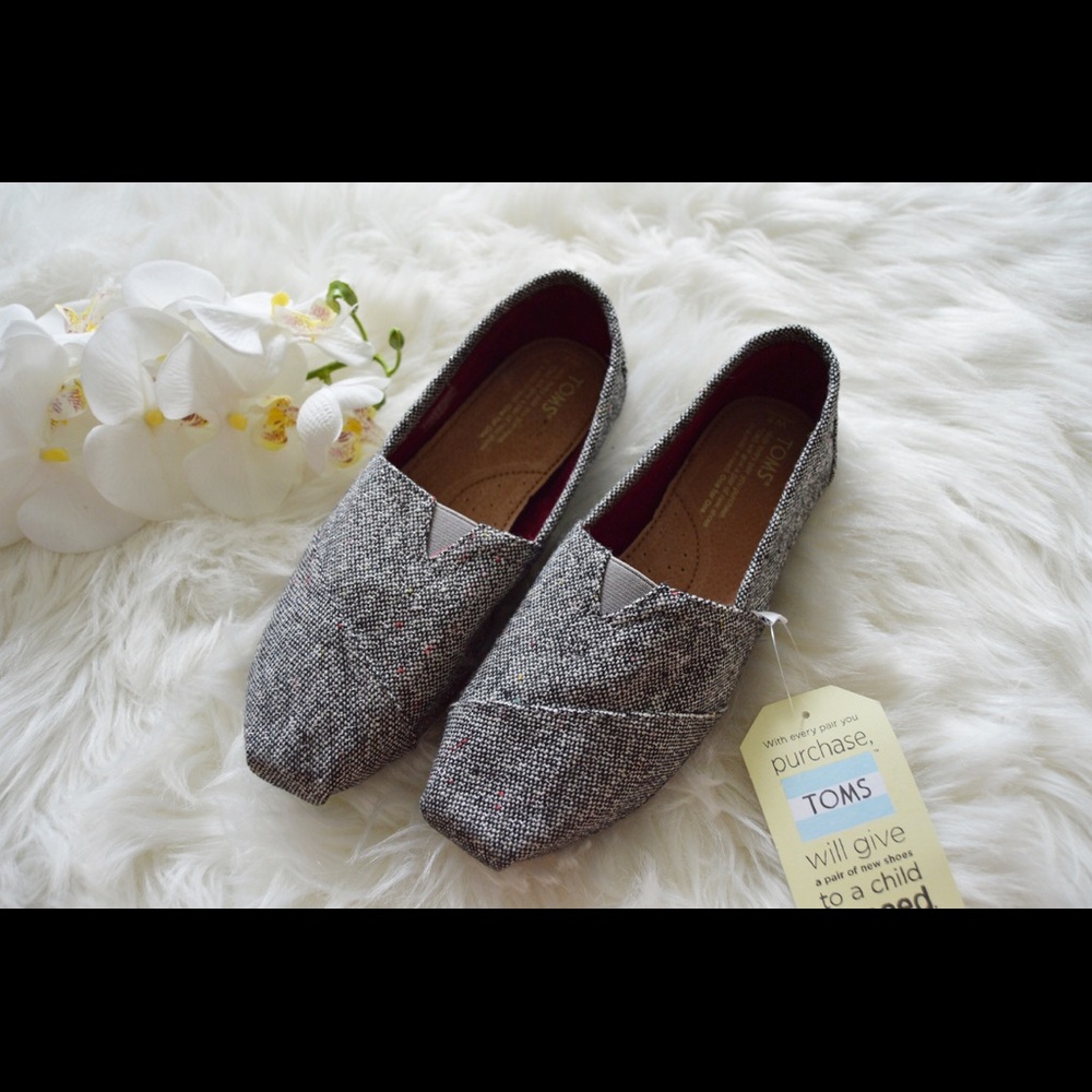 New with tags TOMS Silver Karsen slip ons.