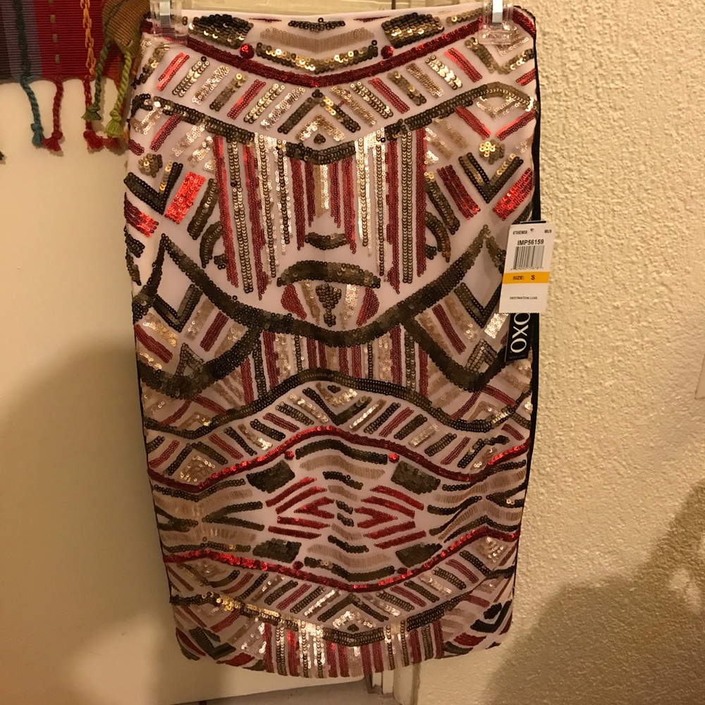 This is a "pencil" skirt. NWT. Size S by XOXO.