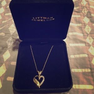 Yellow gold with small diamonds heart necklace.