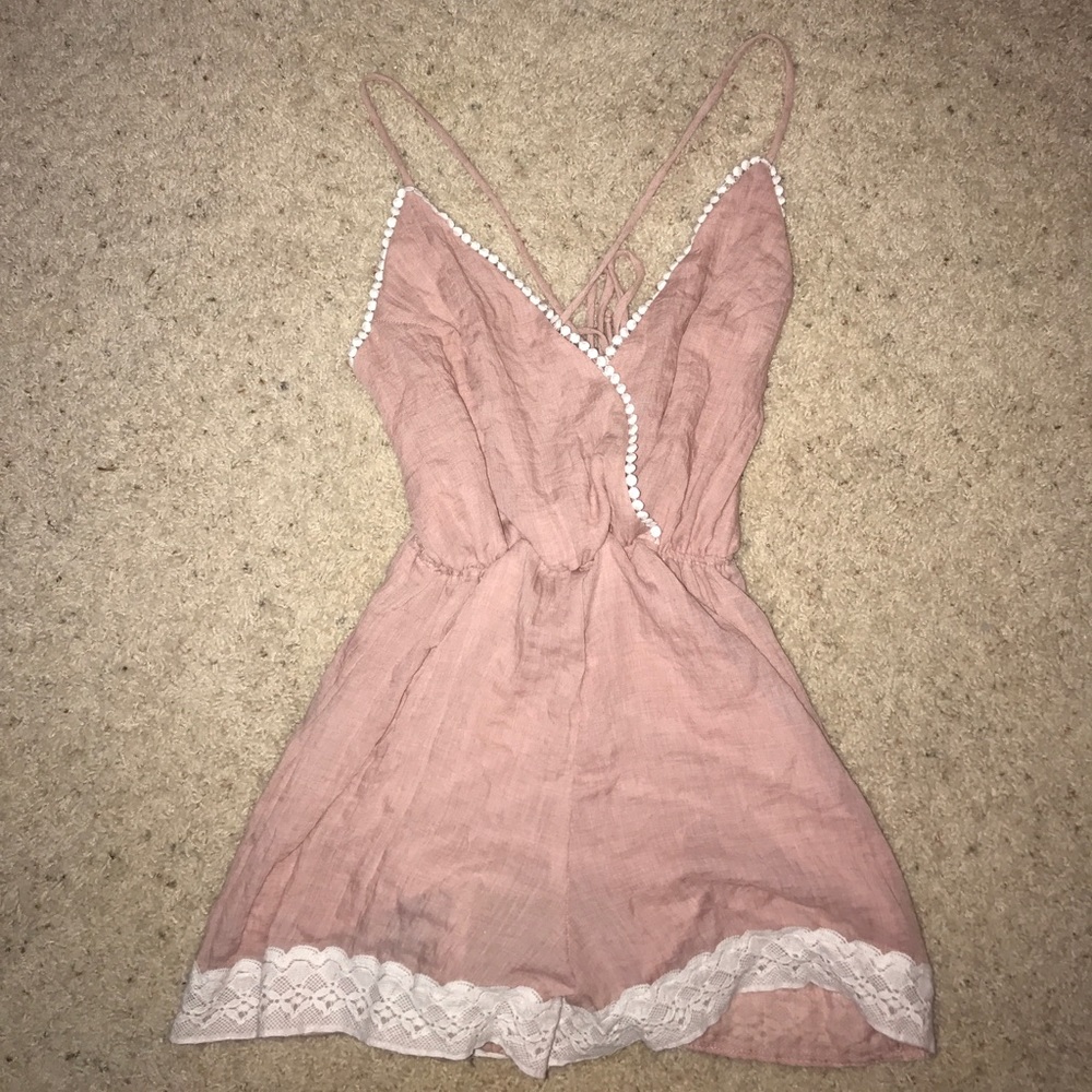 Pink romper.