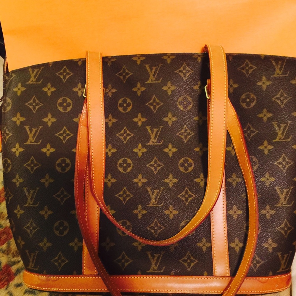 SOLD!Authentic Lv monogramcanvasLeather Babylone .