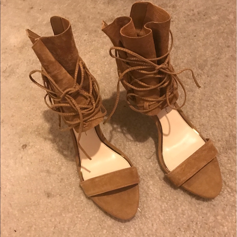 Tan suede open toe and ties around the ankle.
