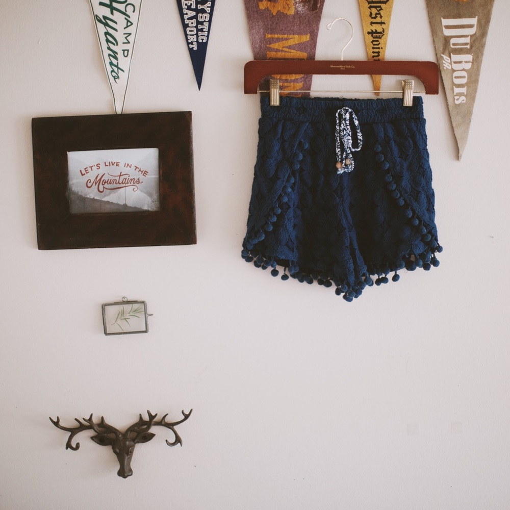 Navy pom pom shorts