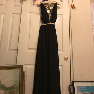 Never been worn black and gold party dress